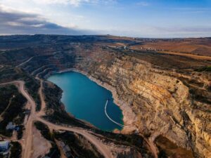 Abandoned limestone quarry with lake at the bottom.